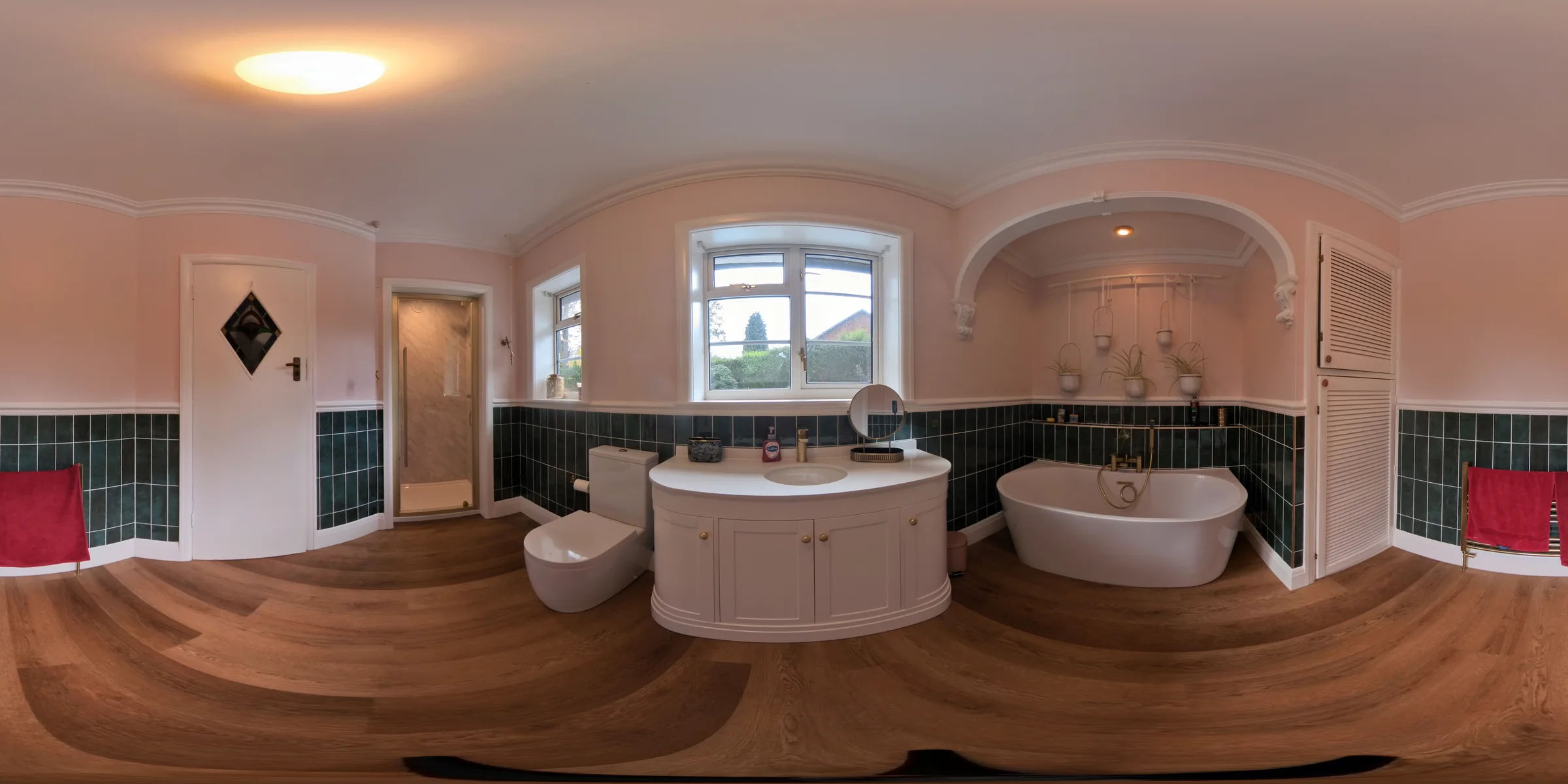 Traditional bathroom with freestanding bath and curved vanity